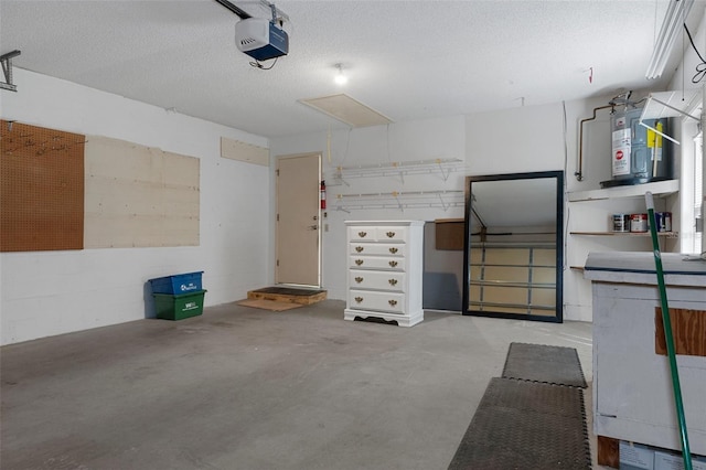garage with a garage door opener and concrete block wall