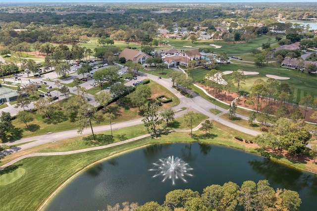 bird's eye view featuring golf course view, a water view, and a residential view