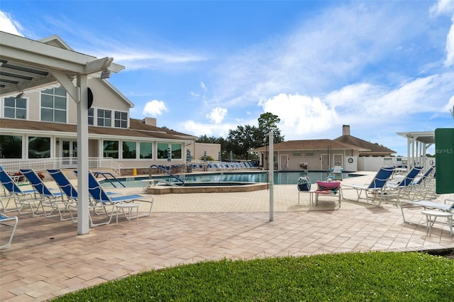 pool with fence and a patio