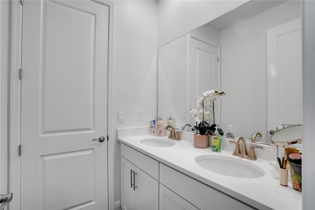 full bath featuring double vanity and a sink
