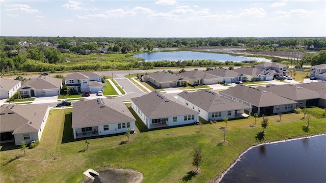 drone / aerial view featuring a water view and a residential view