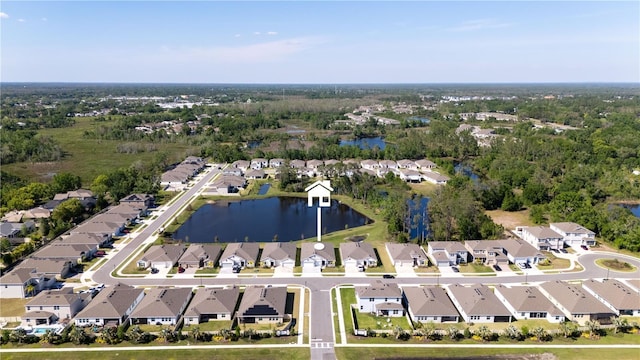 birds eye view of property with a residential view and a water view