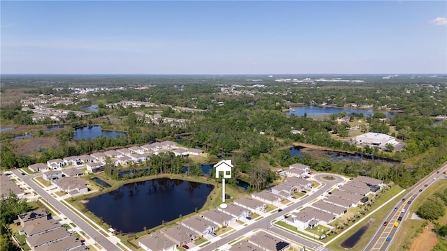 drone / aerial view with a water view and a residential view
