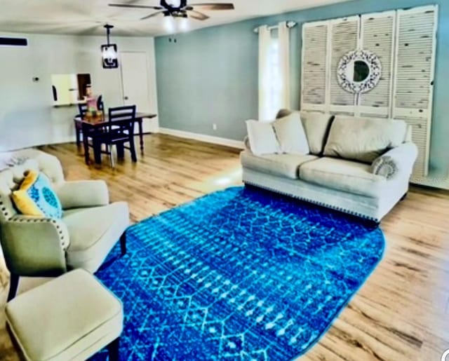 717 Cordova Grn, Seminole, FL 33777 - living area with ceiling fan and wood finished floors