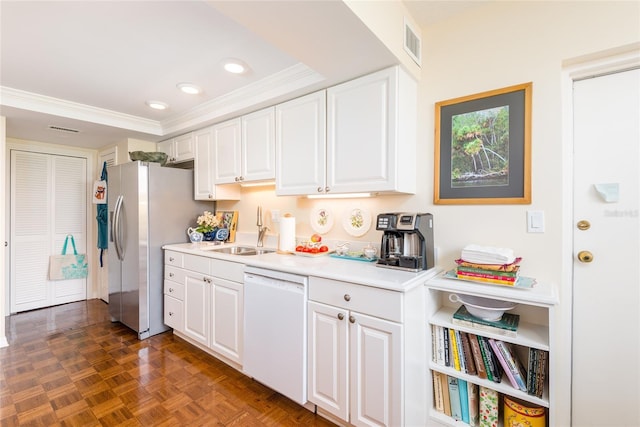 kitchen with white cabinetry, visible vents, a sink, and dishwasher