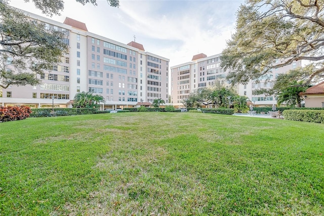 surrounding community featuring a yard