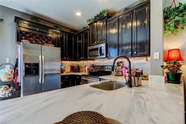 4676 66th Pl N, Pinellas Park, FL 33781 - kitchen featuring light stone countertops, recessed lighting, appliances with stainless steel finishes, a sink, and decorative backsplash