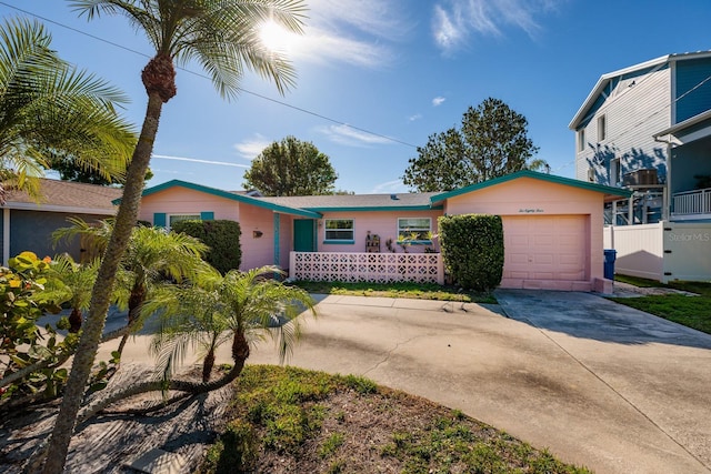 ranch-style home featuring driveway and an attached garage