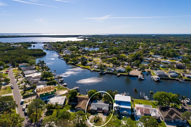 birds eye view of property featuring a residential view and a water view