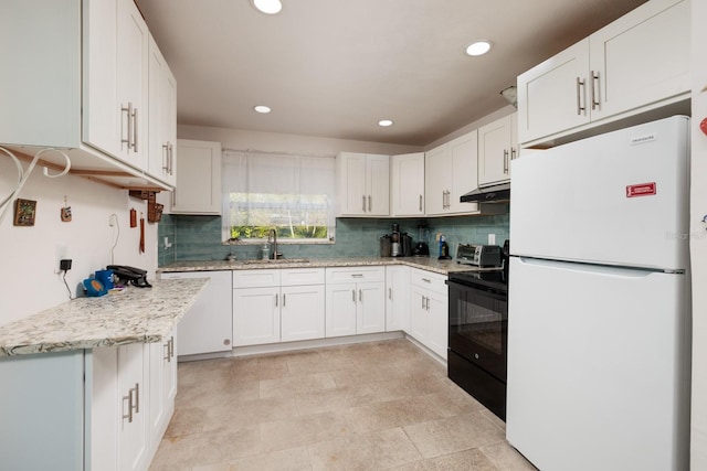 kitchen with under cabinet range hood, a sink, dishwasher, freestanding refrigerator, and black range with electric stovetop