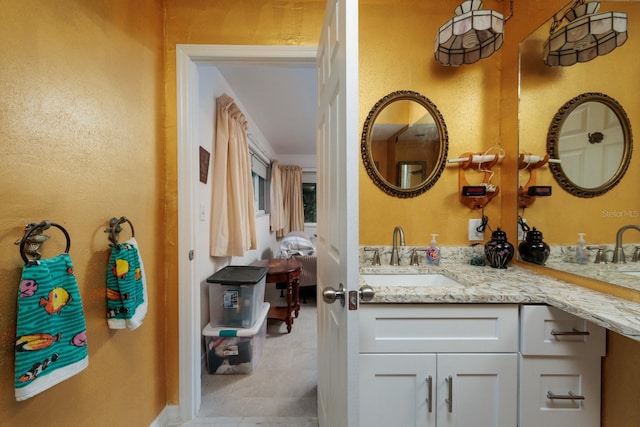 bathroom featuring double vanity and a sink