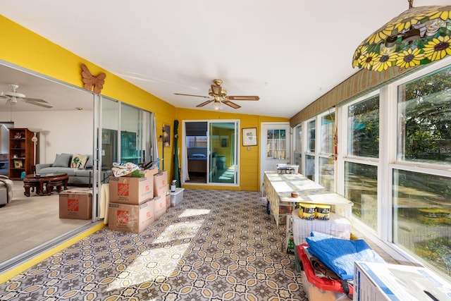 sunroom / solarium featuring vaulted ceiling