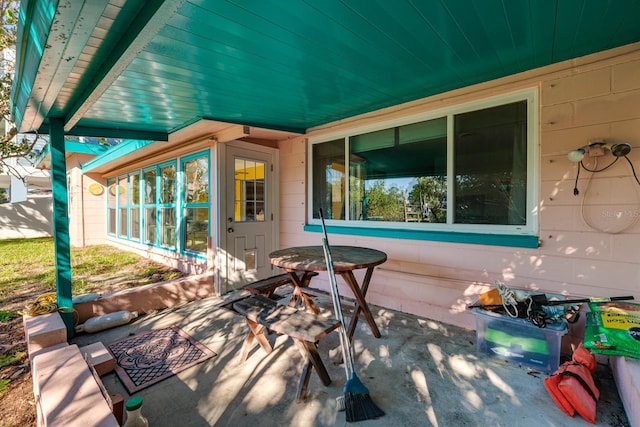 view of patio / terrace with a sunroom