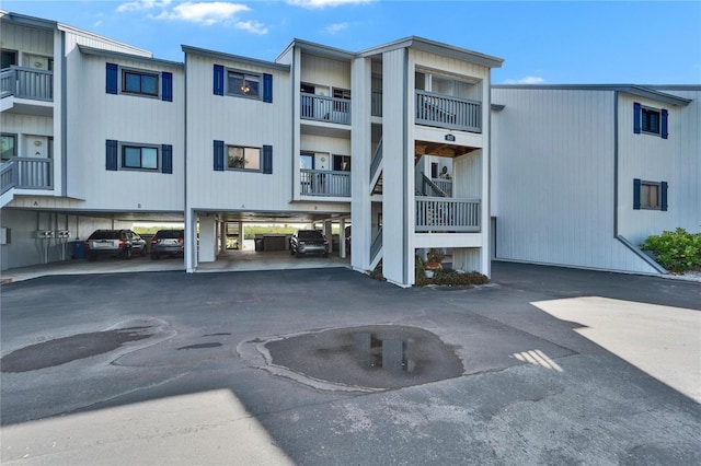 view of property featuring covered parking