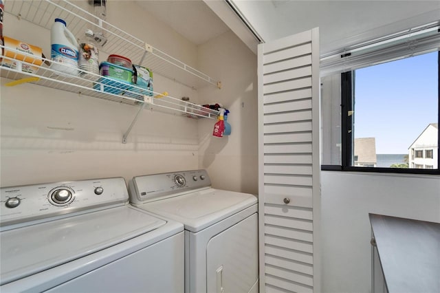 washroom featuring laundry area and separate washer and dryer