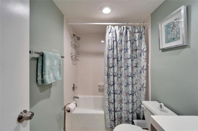 bathroom with toilet, vanity, and shower / tub combo with curtain