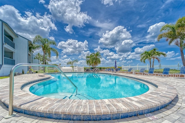 community pool featuring fence