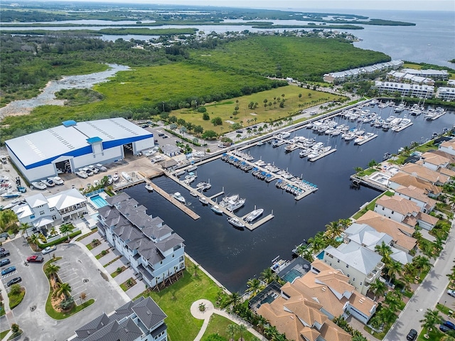 birds eye view of property with a water view