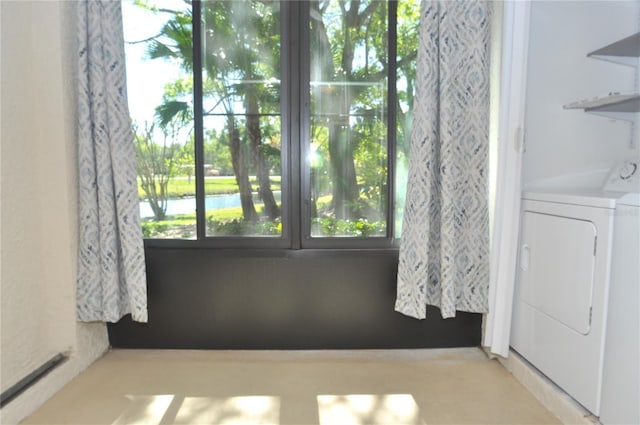 3358 Mermoor Dr Unit 2106, Palm Harbor, FL 34685 - laundry room featuring a water view, a healthy amount of sunlight, and laundry area