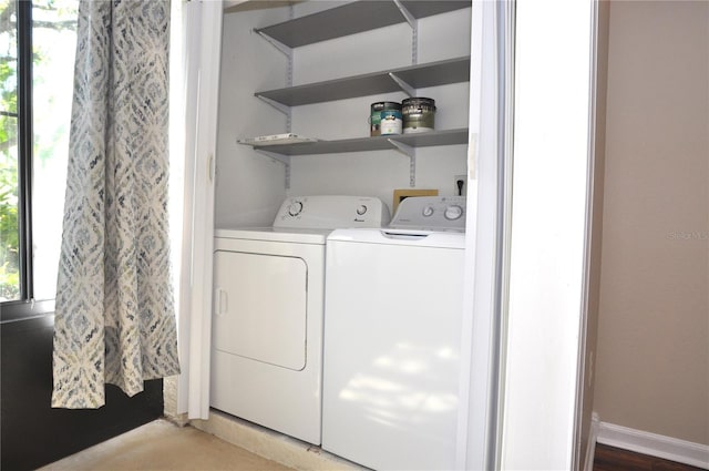 3358 Mermoor Dr Unit 2106, Palm Harbor, FL 34685 - laundry area with baseboards, washer and dryer, and laundry area
