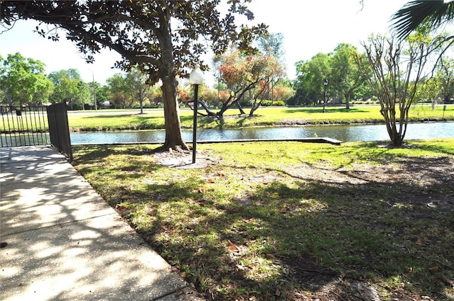 3358 Mermoor Dr Unit 2106, Palm Harbor, FL 34685 - view of property's community featuring a lawn and a water view
