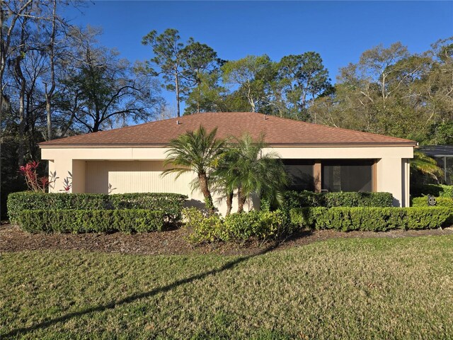 3358 Mermoor Dr Unit 2106, Palm Harbor, FL 34685 - view of side of home with stucco siding and a yard