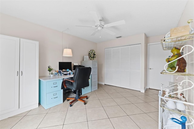 office featuring ceiling fan, visible vents, and light tile patterned floors