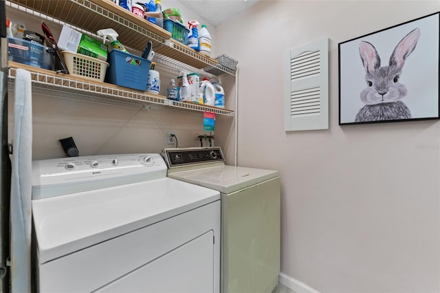 laundry area featuring laundry area and washer and clothes dryer