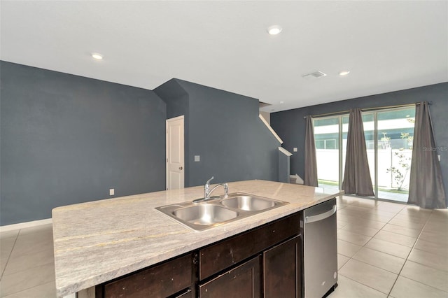 kitchen featuring light countertops, visible vents, dark brown cabinetry, a sink, and stainless steel dishwasher