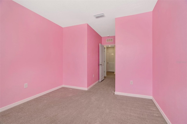 interior space featuring light carpet, baseboards, and visible vents