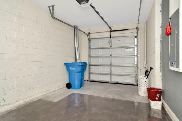 garage featuring electric panel and a garage door opener
