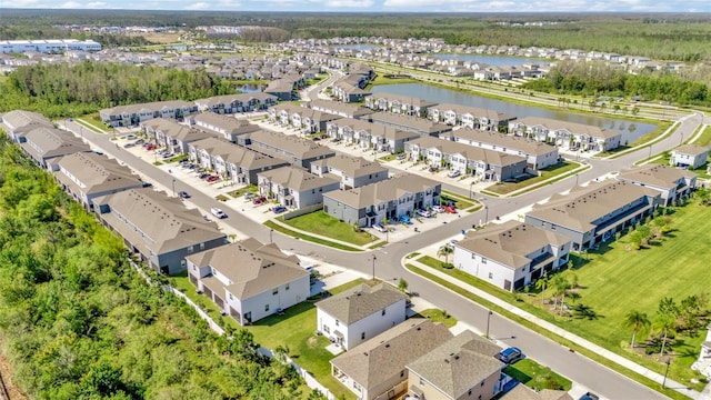 bird's eye view featuring a water view and a residential view