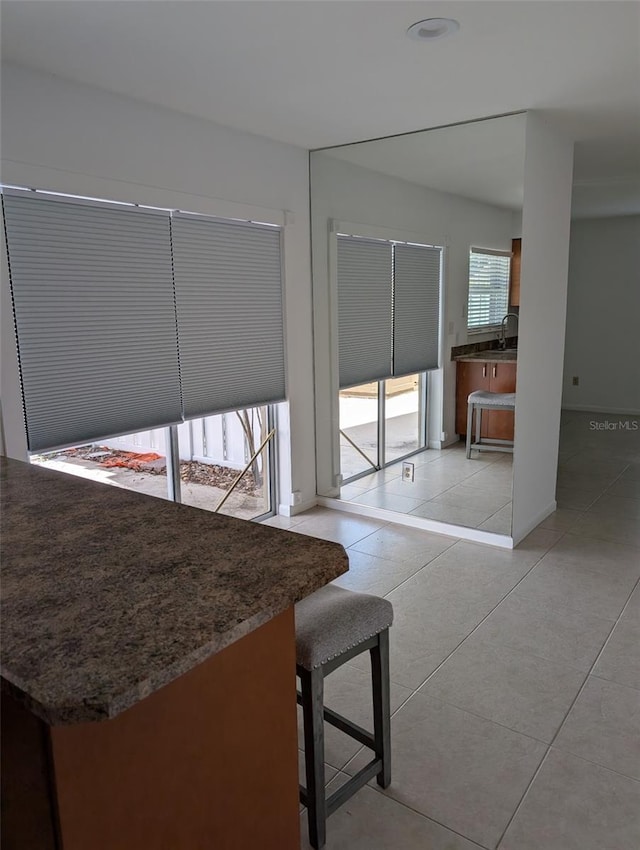 7112 Eldorado Dr, Tampa, FL 33615 - interior space featuring light tile patterned floors and baseboards