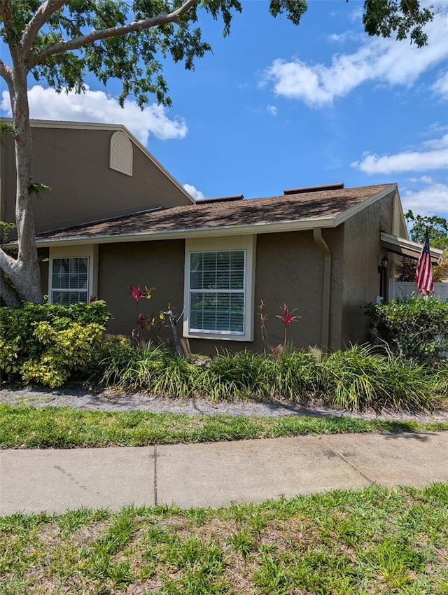 7112 Eldorado Dr, Tampa, FL 33615 - view of side of property featuring stucco siding