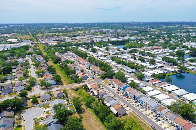 drone / aerial view with a residential view and a water view