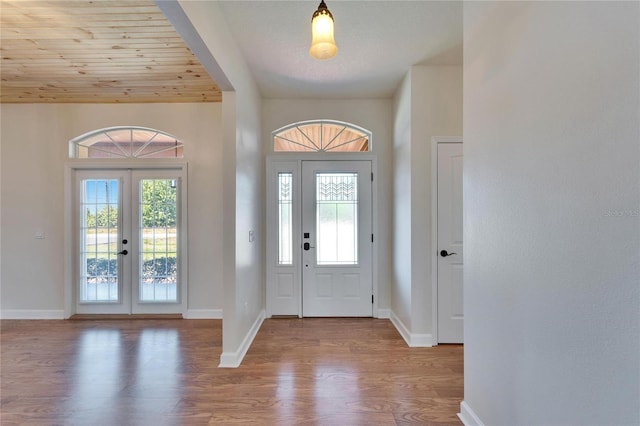14807 Capps Estates Ln, Wimauma, FL 33598 - foyer entrance featuring wood finished floors, french doors, and wooden ceiling