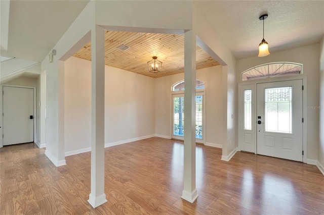 14807 Capps Estates Ln, Wimauma, FL 33598 - foyer entrance with light wood-type flooring and wooden ceiling