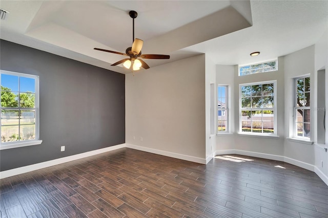 14807 Capps Estates Ln, Wimauma, FL 33598 - empty room with a ceiling fan and dark wood-style floors