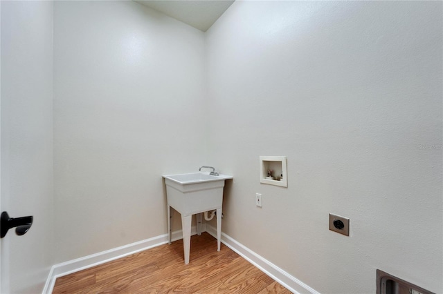 14807 Capps Estates Ln, Wimauma, FL 33598 - laundry area with electric dryer hookup, light wood-style floors, and hookup for a washing machine