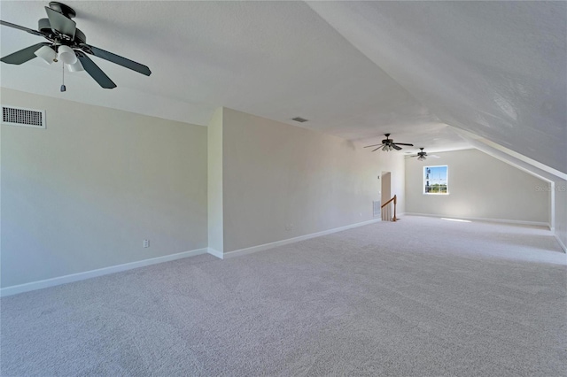 14807 Capps Estates Ln, Wimauma, FL 33598 - bonus room featuring ceiling fan, vaulted ceiling, and carpet floors