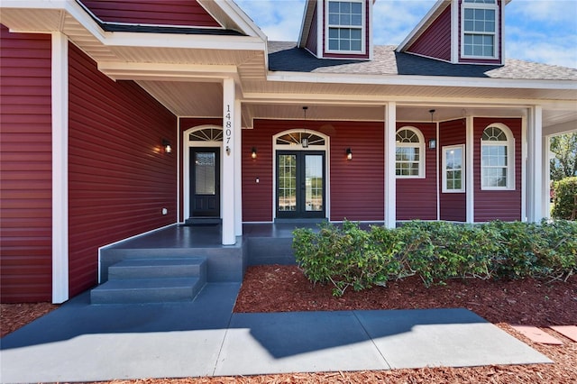 14807 Capps Estates Ln, Wimauma, FL 33598 - view of exterior entry with a porch and a shingled roof
