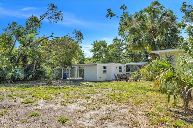 rear view of property with fence