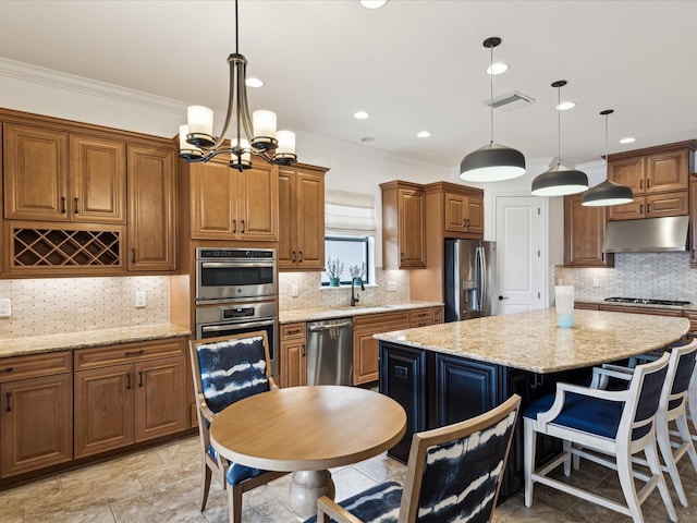 11248 Juglans Dr, Odessa, FL 33556 - kitchen featuring under cabinet range hood, visible vents, stainless steel appliances, and brown cabinetry