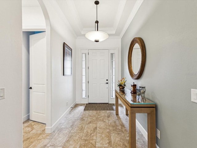 11248 Juglans Dr, Odessa, FL 33556 - foyer entrance featuring baseboards, crown molding, arched walkways, and a raised ceiling