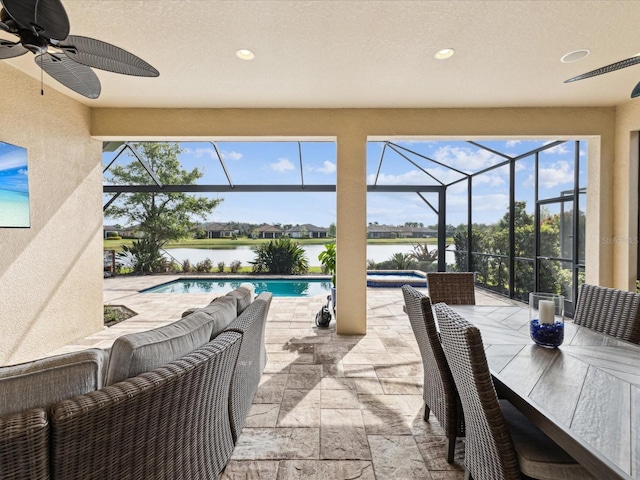 11248 Juglans Dr, Odessa, FL 33556 - view of patio / terrace featuring glass enclosure, an in ground hot tub, a water view, and an outdoor pool