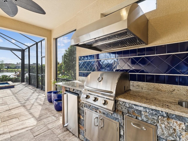 11248 Juglans Dr, Odessa, FL 33556 - view of patio featuring a grill, an outdoor kitchen, a lanai, and a water view