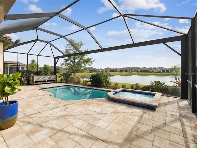 11248 Juglans Dr, Odessa, FL 33556 - view of swimming pool featuring a pool with connected hot tub, a water view, glass enclosure, and a patio area
