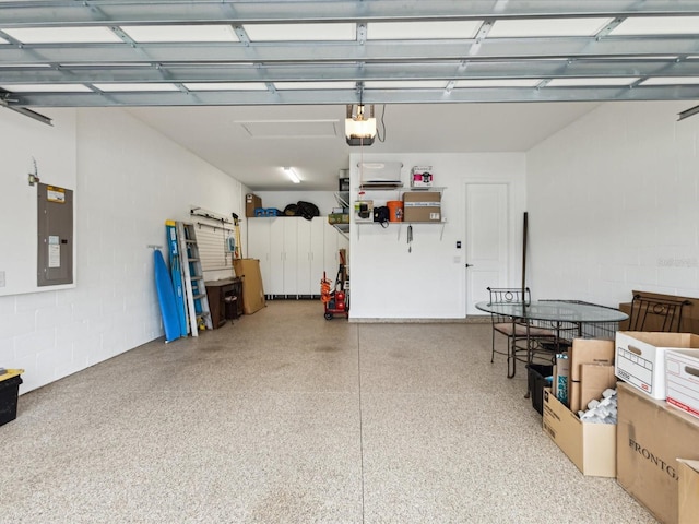 11248 Juglans Dr, Odessa, FL 33556 - garage featuring electric panel, a garage door opener, and concrete block wall