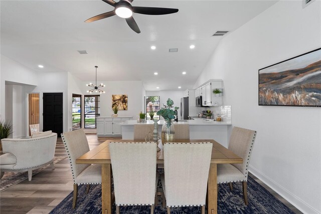 4715 Kemble Ct, Tampa, FL 33624 - dining room with visible vents, baseboards, recessed lighting, light wood-type flooring, and ceiling fan with notable chandelier