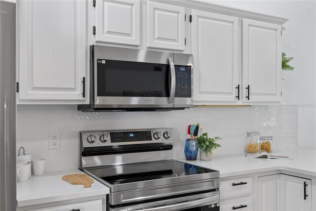 4715 Kemble Ct, Tampa, FL 33624 - kitchen with white cabinetry, tasteful backsplash, light countertops, and stainless steel appliances